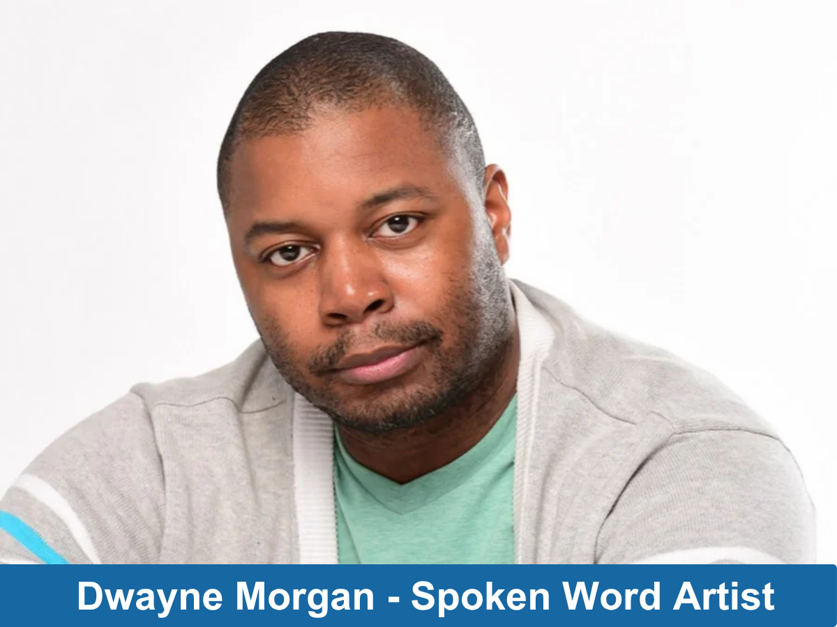 headshot of black man wearing grey sweater